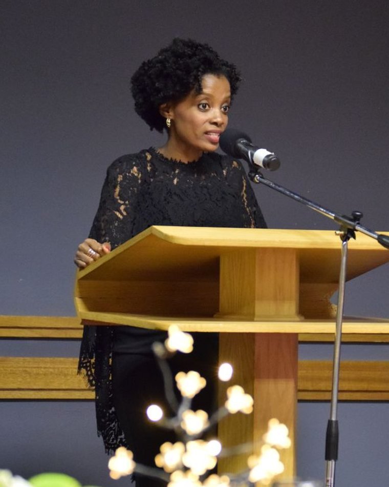 Maud Nale speaking at a lectern